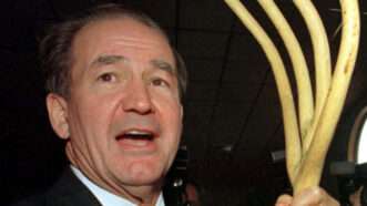 culture | Photo: Pat Buchanan autographs a supporter’s pitchfork after announcing he will make a third run at the White House in the 2000 election; Reuters/Alamy