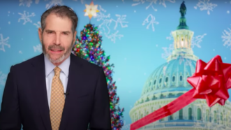 John Stossel is seen in front of a Christmas tree and the U.S. Capitol | Stossel TV