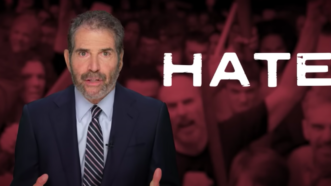 John Stossel is seen next to the word "hate" | Stossel TV